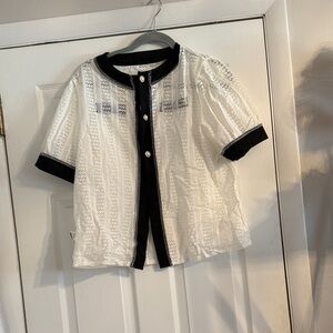 Stylish black and white lace cardigan with pearl buttons